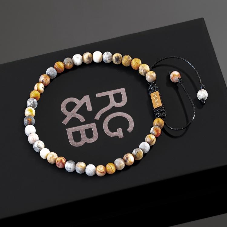 Our Crazy Lace Agate Bead Bracelet Features Natural Stones, Waxed Cord and Brushed Rose Gold Steel Hardware. A Beautiful Addition to any Collection.